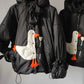 Down jacket  "Little duck" in black with detachable bows and removable hood