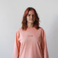 Longsleeve with a symbolic inscription «Human» peach
