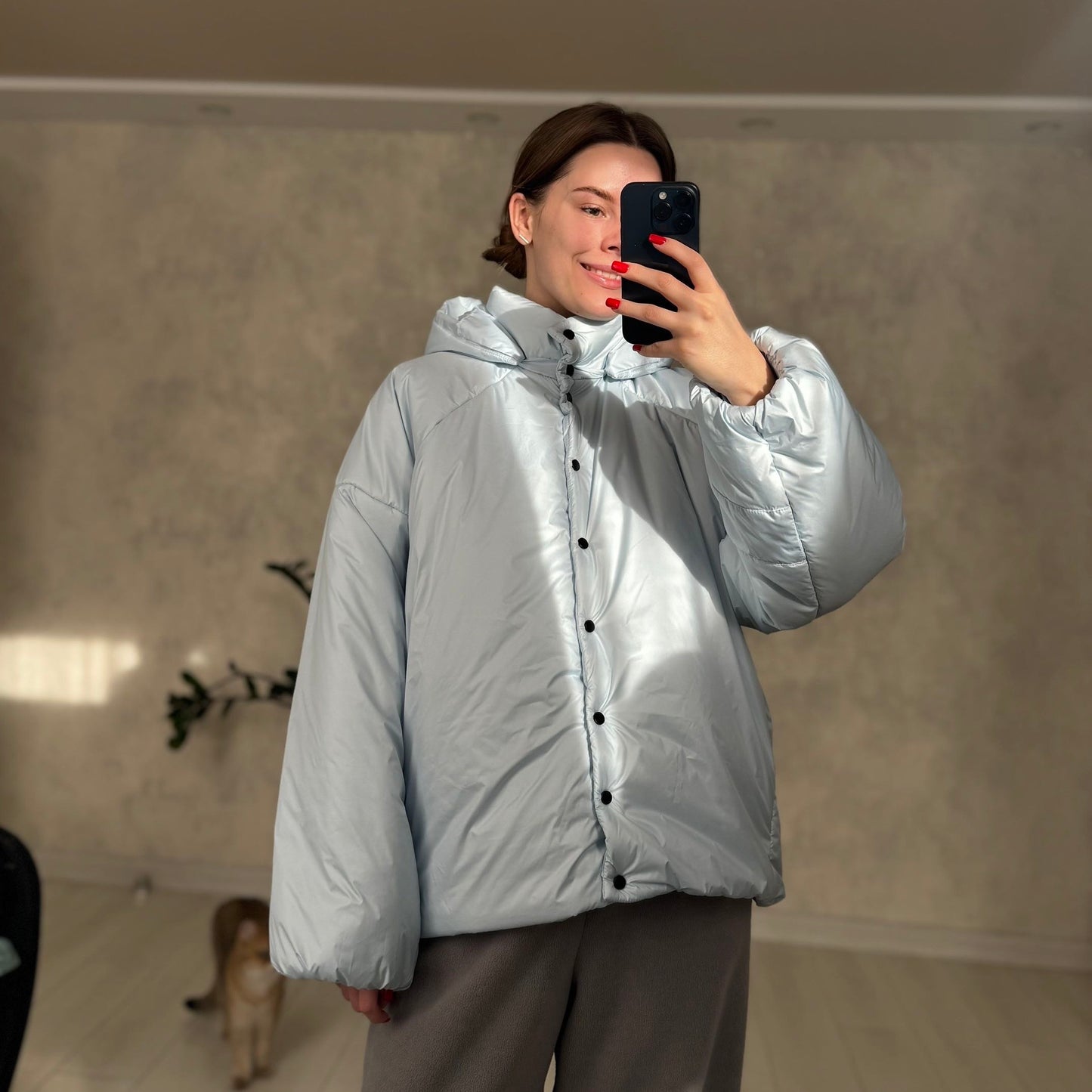 Down jacket in blue with detachable bows and removable hood