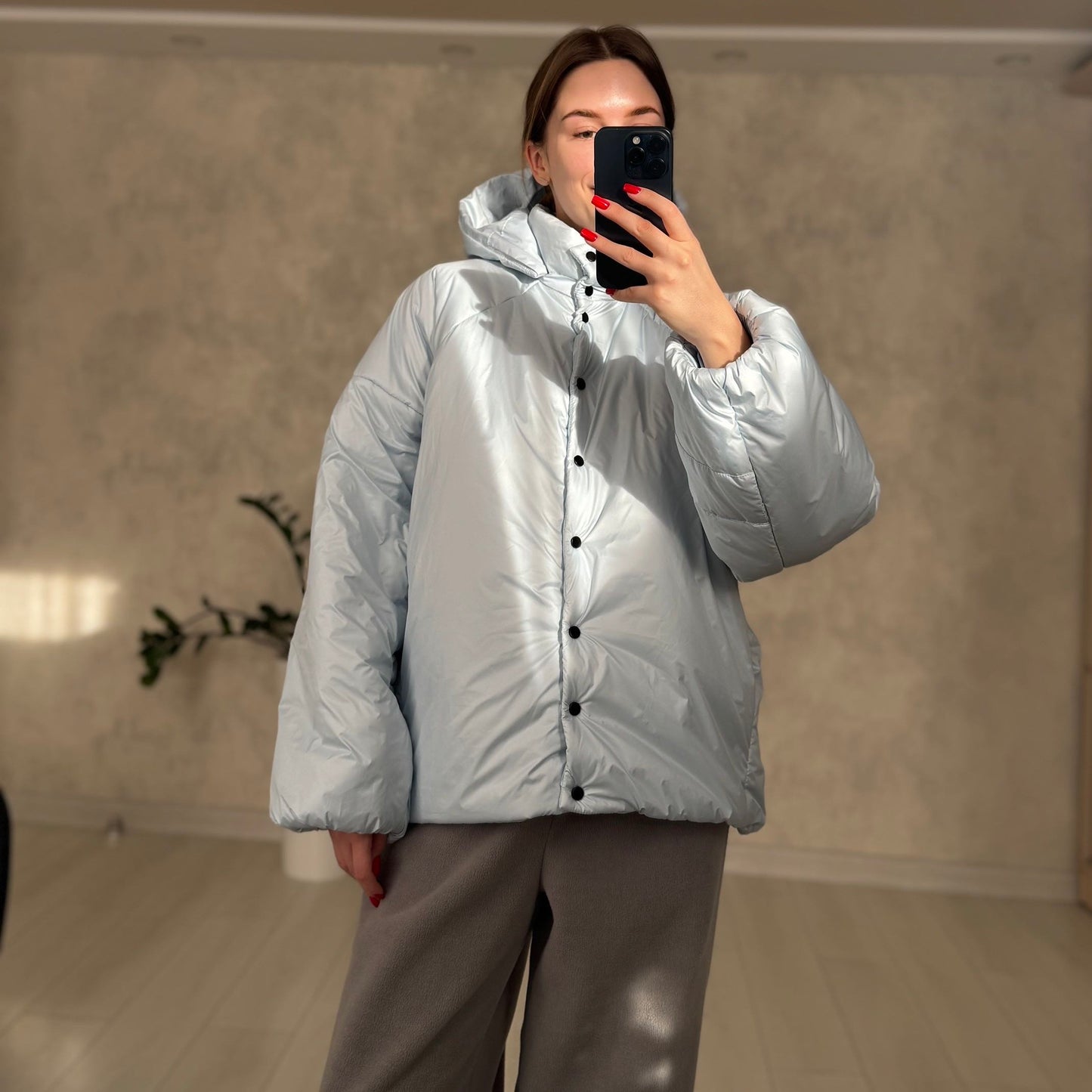 Down jacket in blue with detachable bows and removable hood