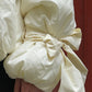 Down jacket  "Little duck" in yellow butter with detachable bows and removable hood