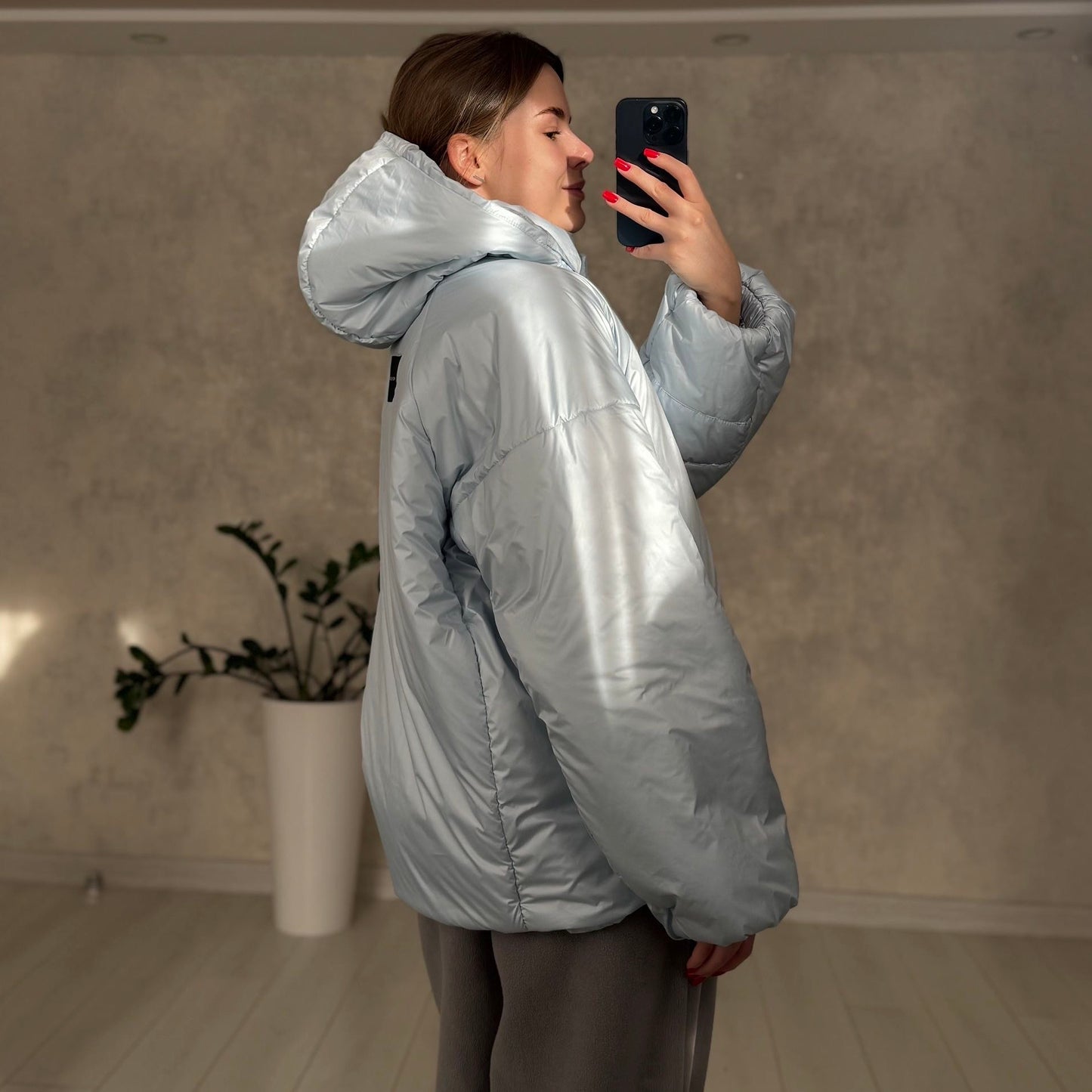 Down jacket in blue with detachable bows and removable hood