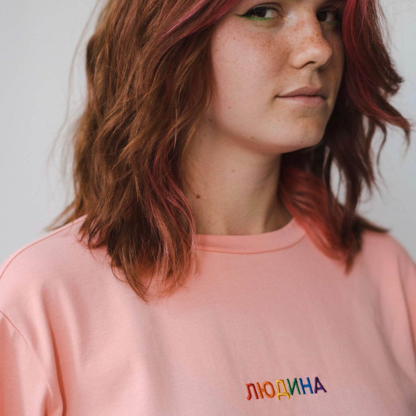 Longsleeve with a symbolic inscription «Human» peach