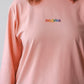 Longsleeve with a symbolic inscription «Human» peach