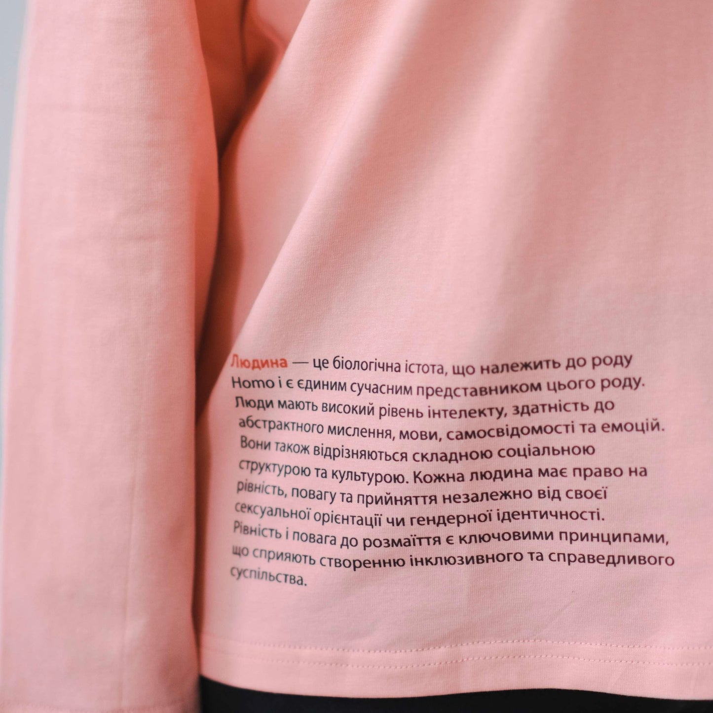 Longsleeve with a symbolic inscription «Human» peach