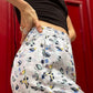 Pants with flounces a bird print