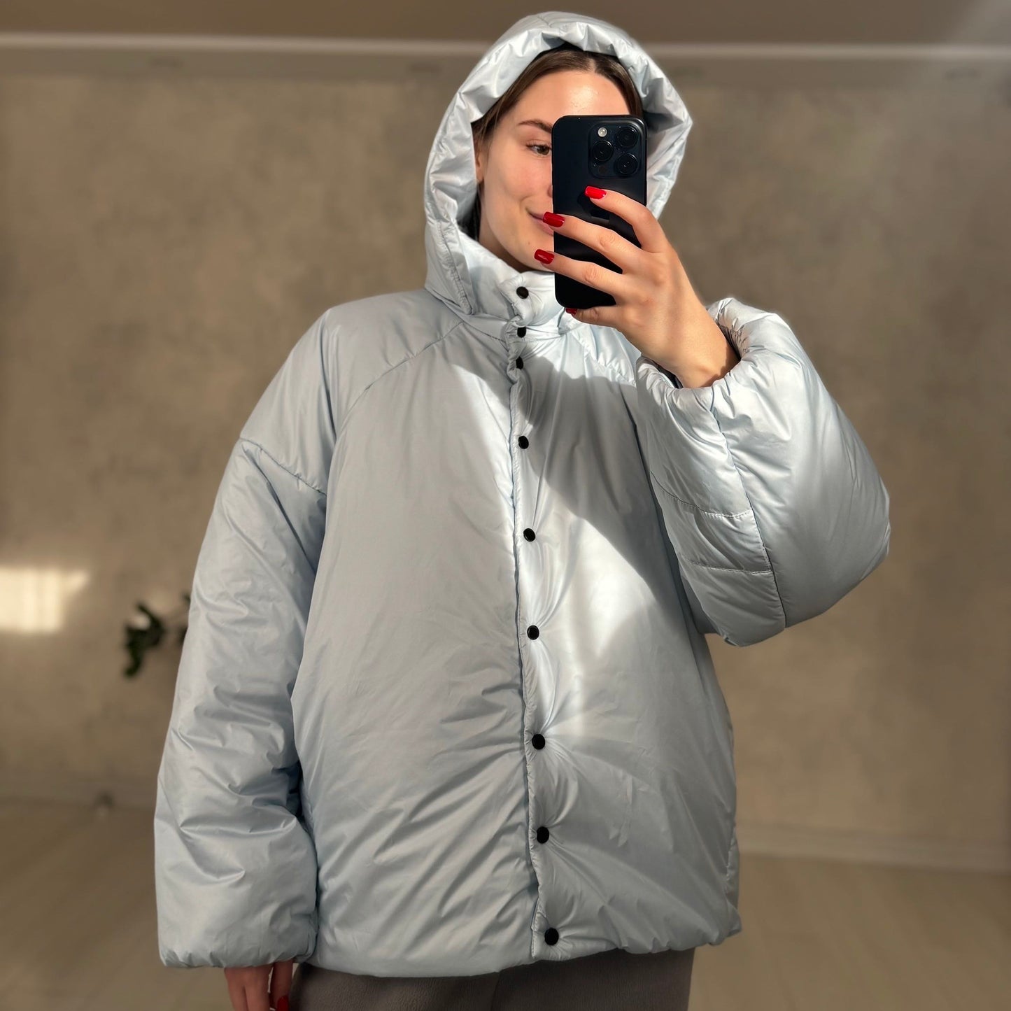 Down jacket in blue with detachable bows and removable hood