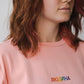 Longsleeve with a symbolic inscription «Human» peach