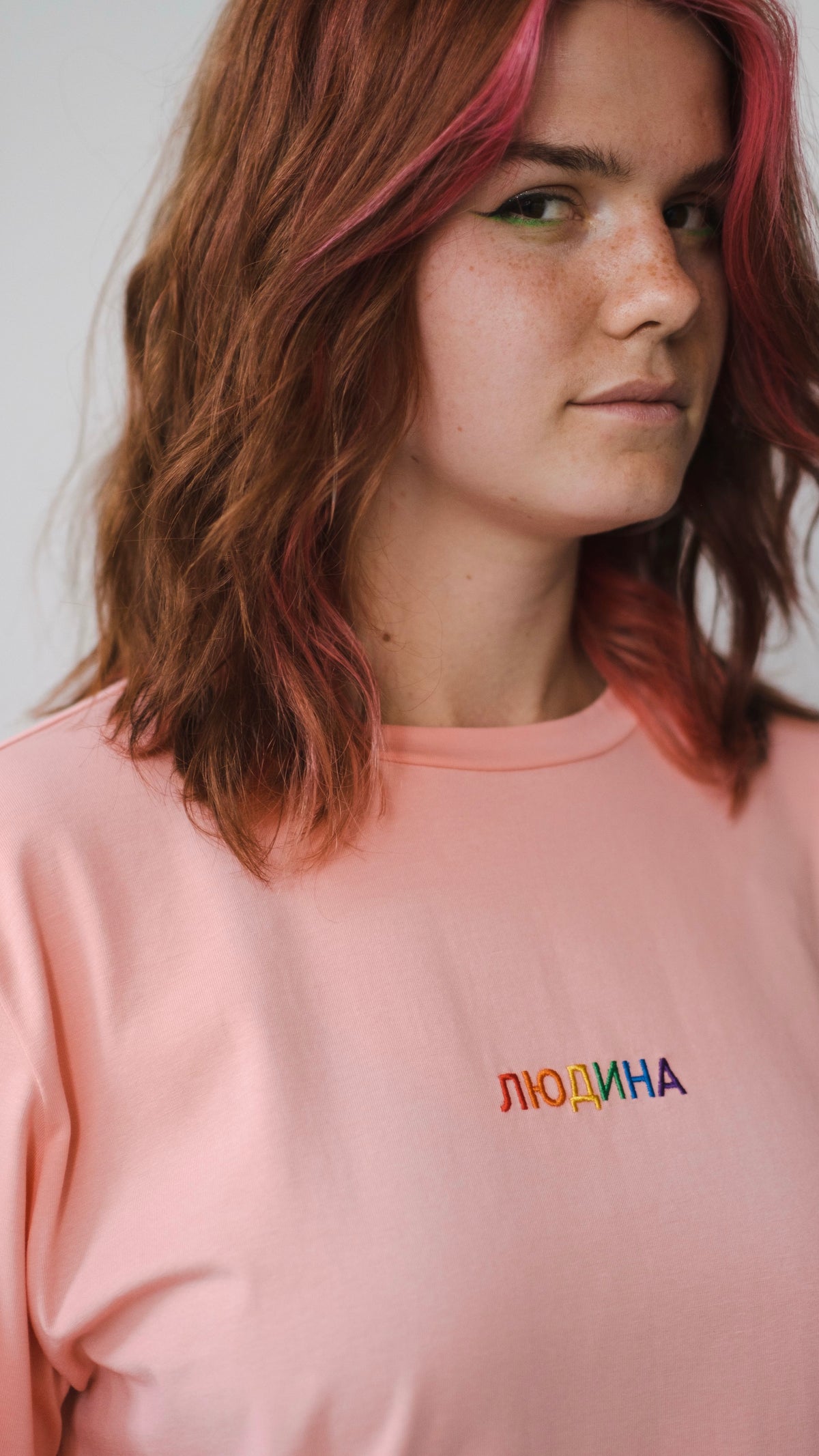 Longsleeve with a symbolic inscription «Human» peach
