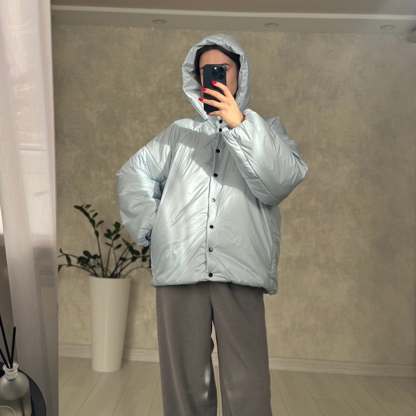 Down jacket in blue with detachable bows and removable hood