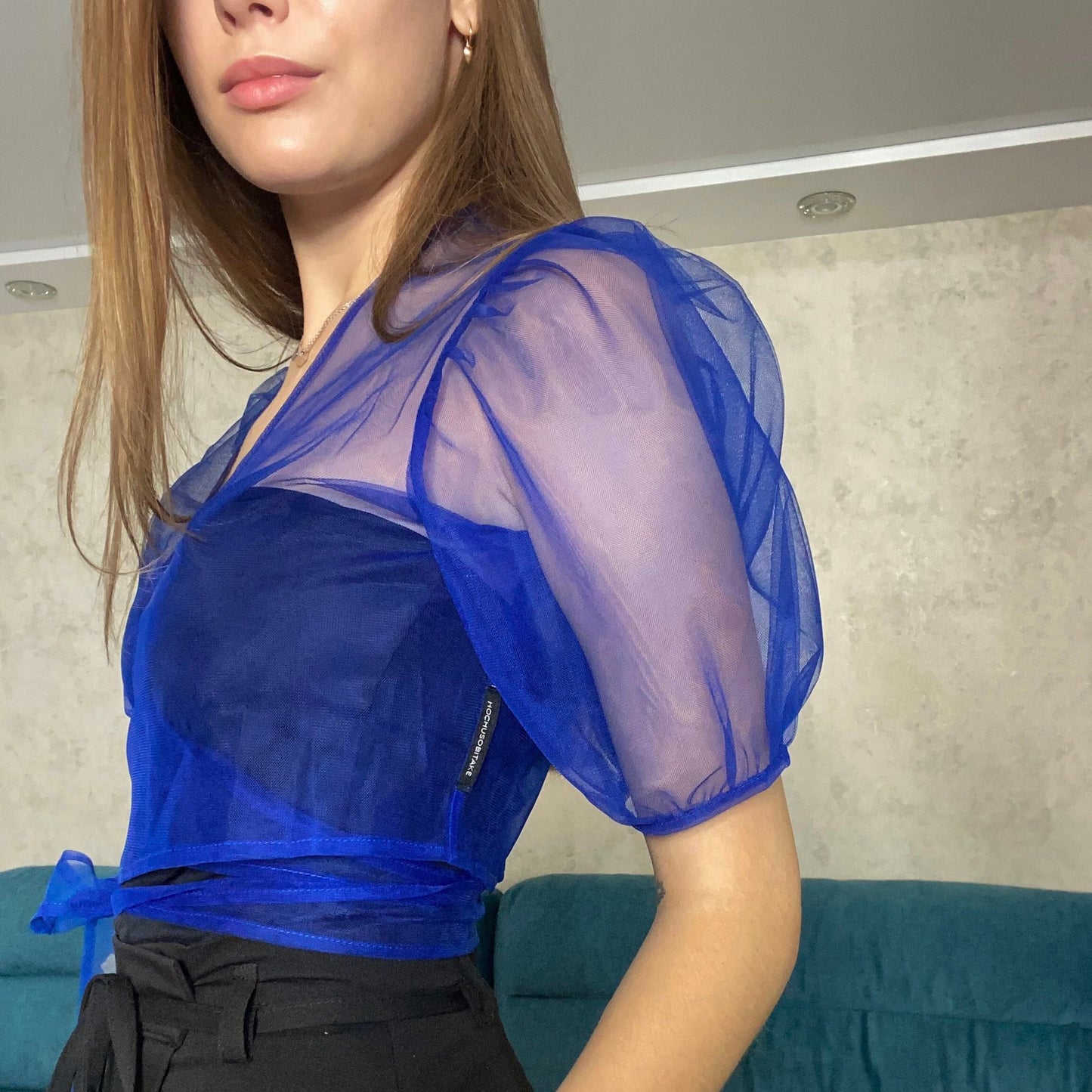 Transparent blue blouse with flounces