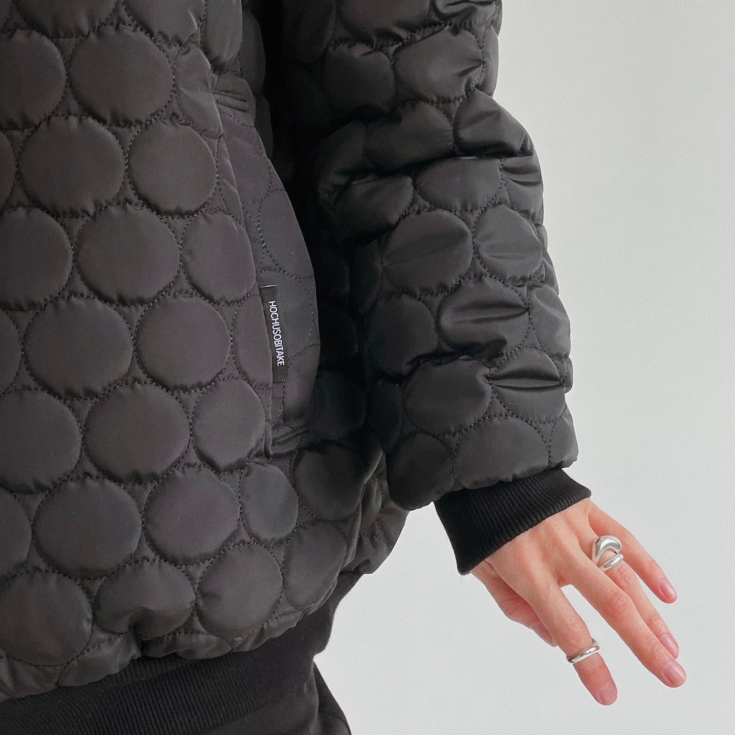 Demi-season doublesided quilted bomber jacket in black/emerald  color