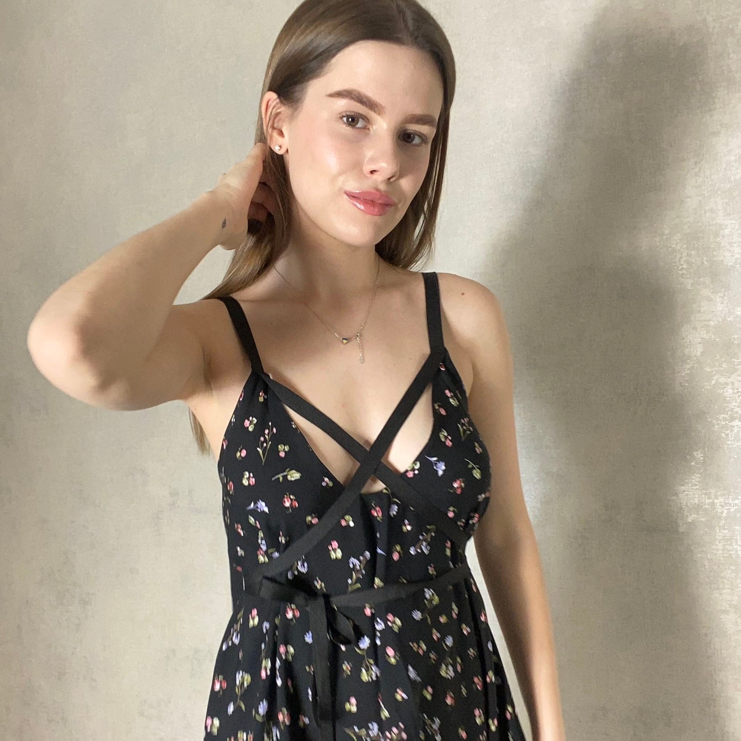 Black dress with ribbons with a floral print
